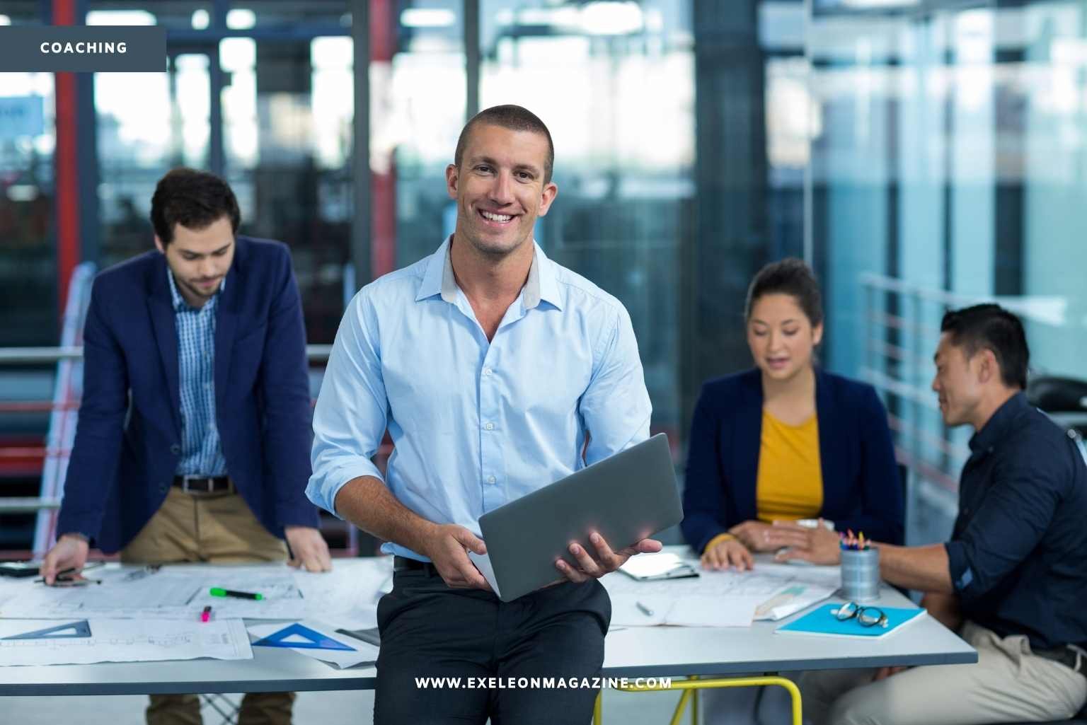 Sales Coaching Man standing with employees