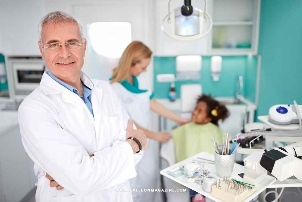 Dentist posing to the camera in his dental practice