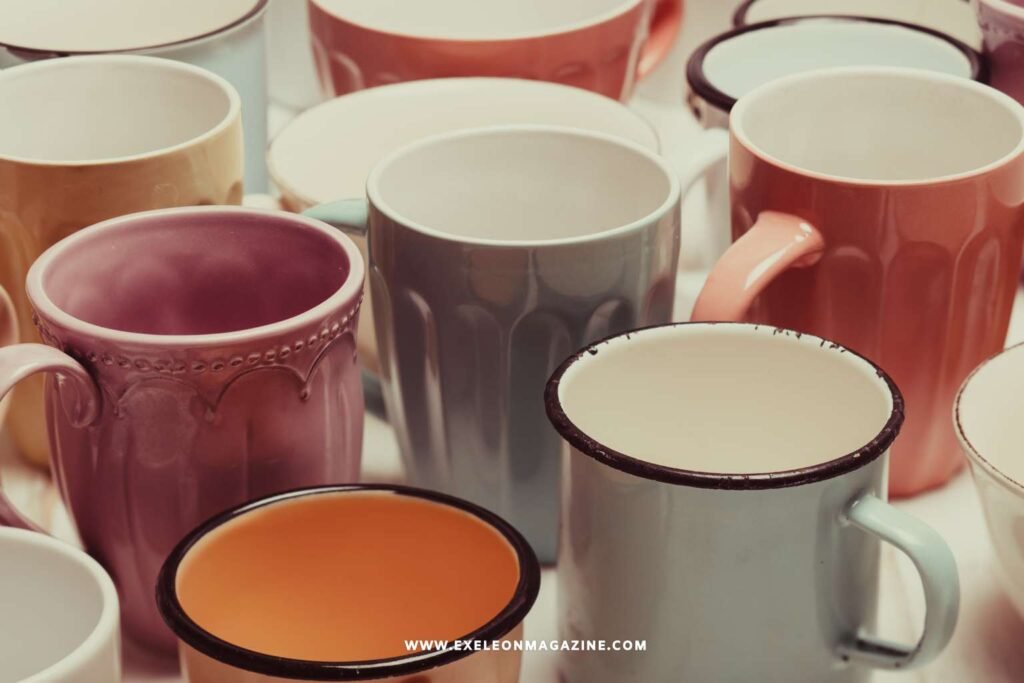 Custom ceramic mugs displayed on a wooden table